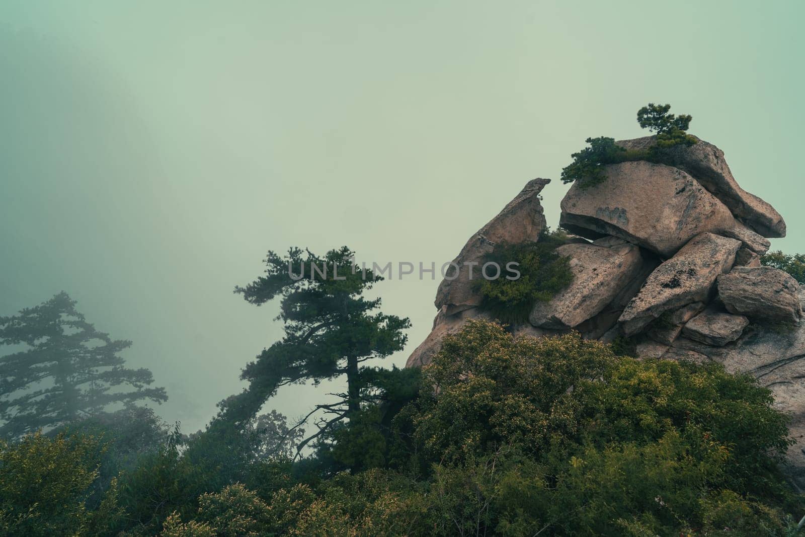 Pile of massive boulders on the summit of mountain landscape seen from the West Peak on Hua Shan mountain, Xian, Shaanxi Province, China