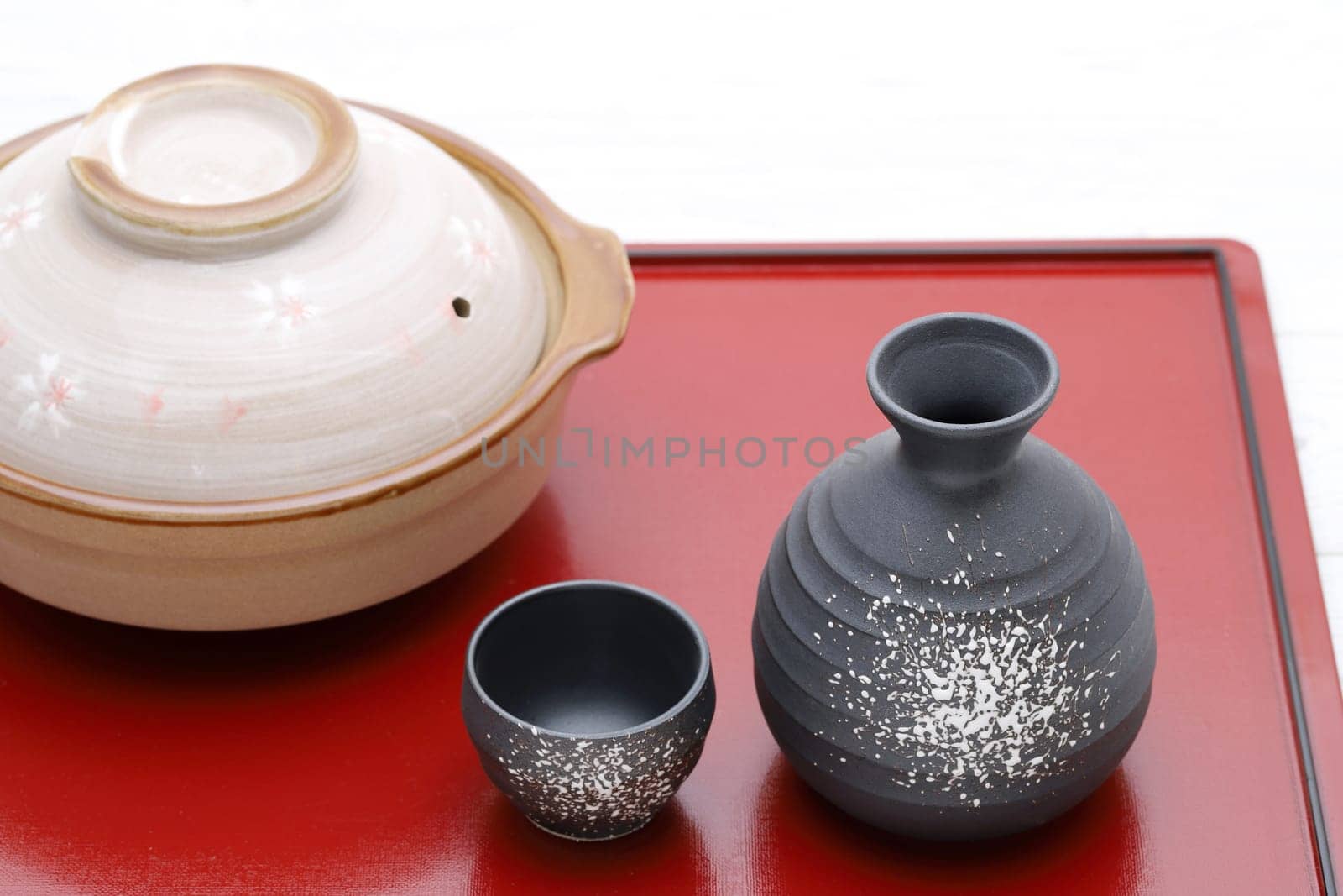 Japanese traditional sake cup and bottle on tray