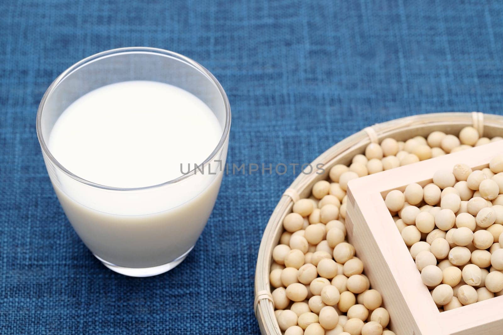 Glass of tonyu milk with soy bean on dining table
