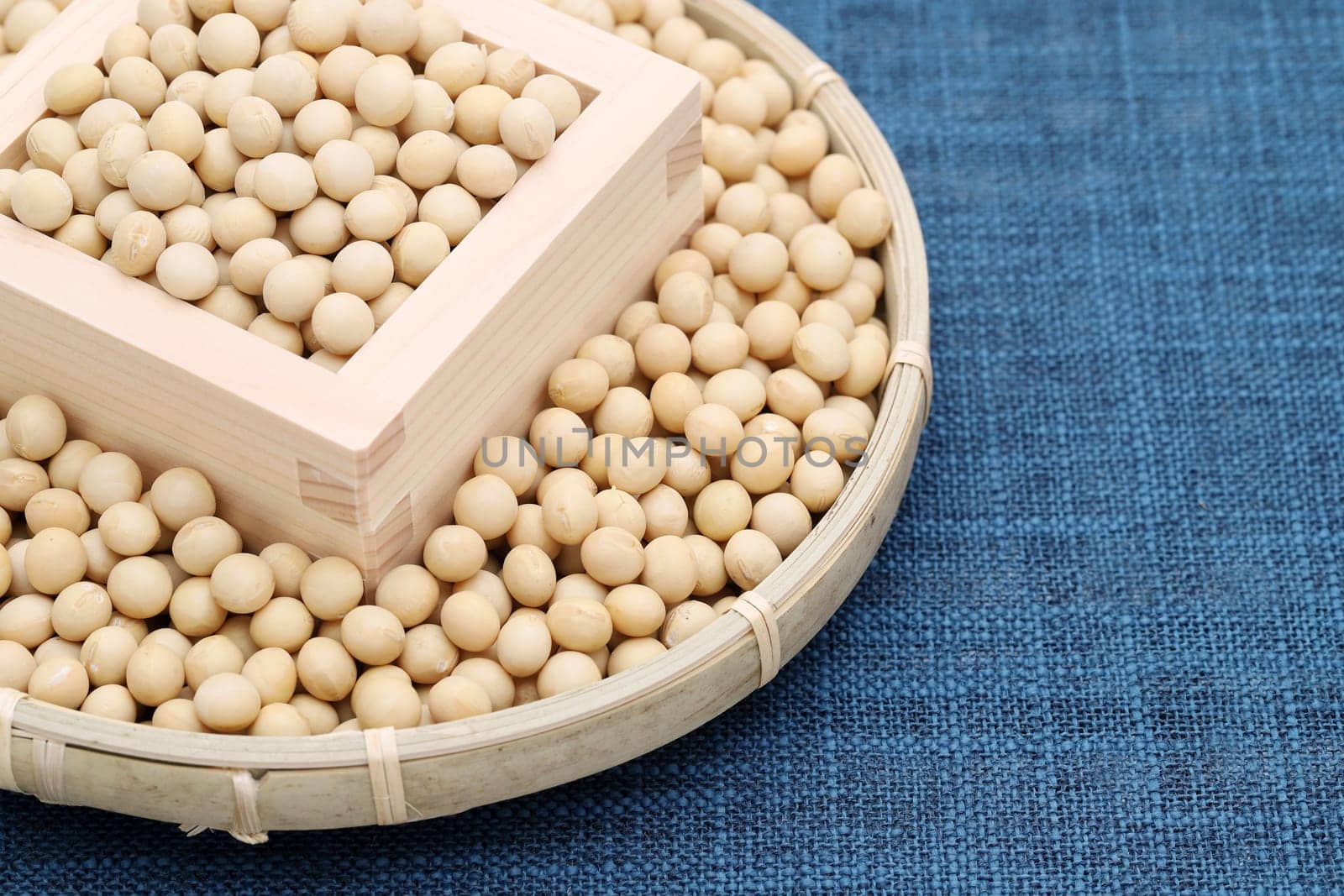 Japanese soybeans daizu in a wooden masu and bamboo basket