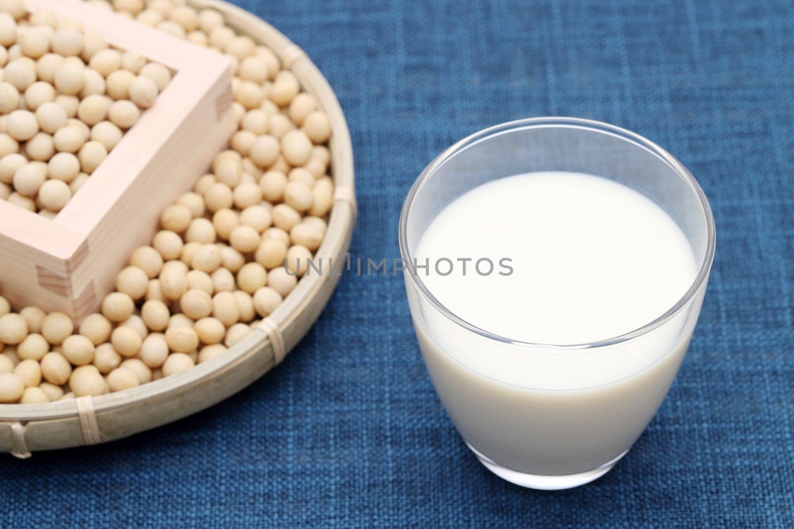Glass of tonyu milk with soy bean on dining table