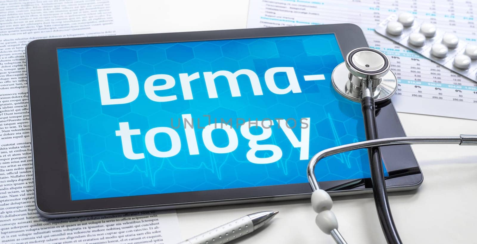 The word Dermatology on the display of a tablet