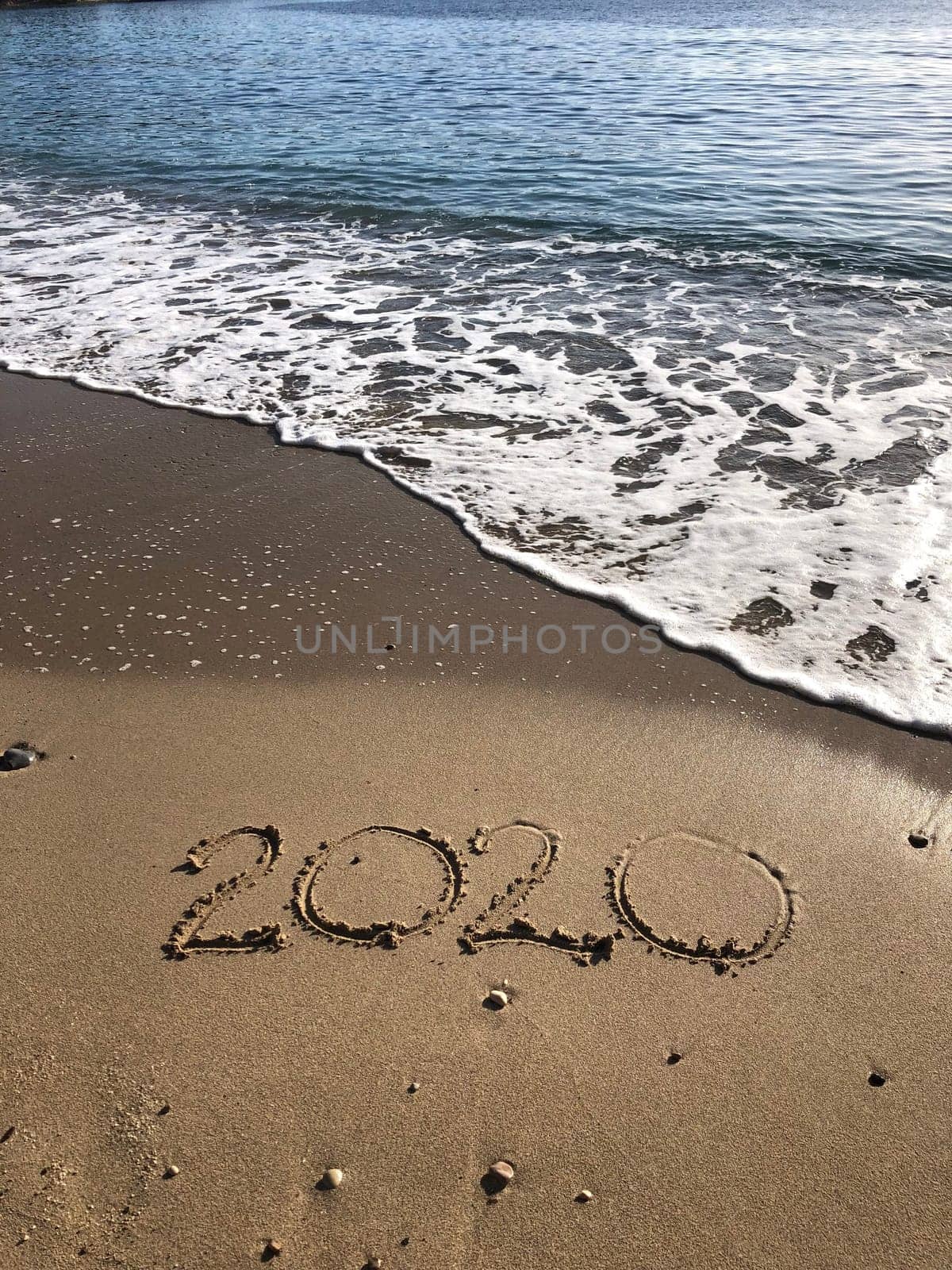 2020 sign written in sand