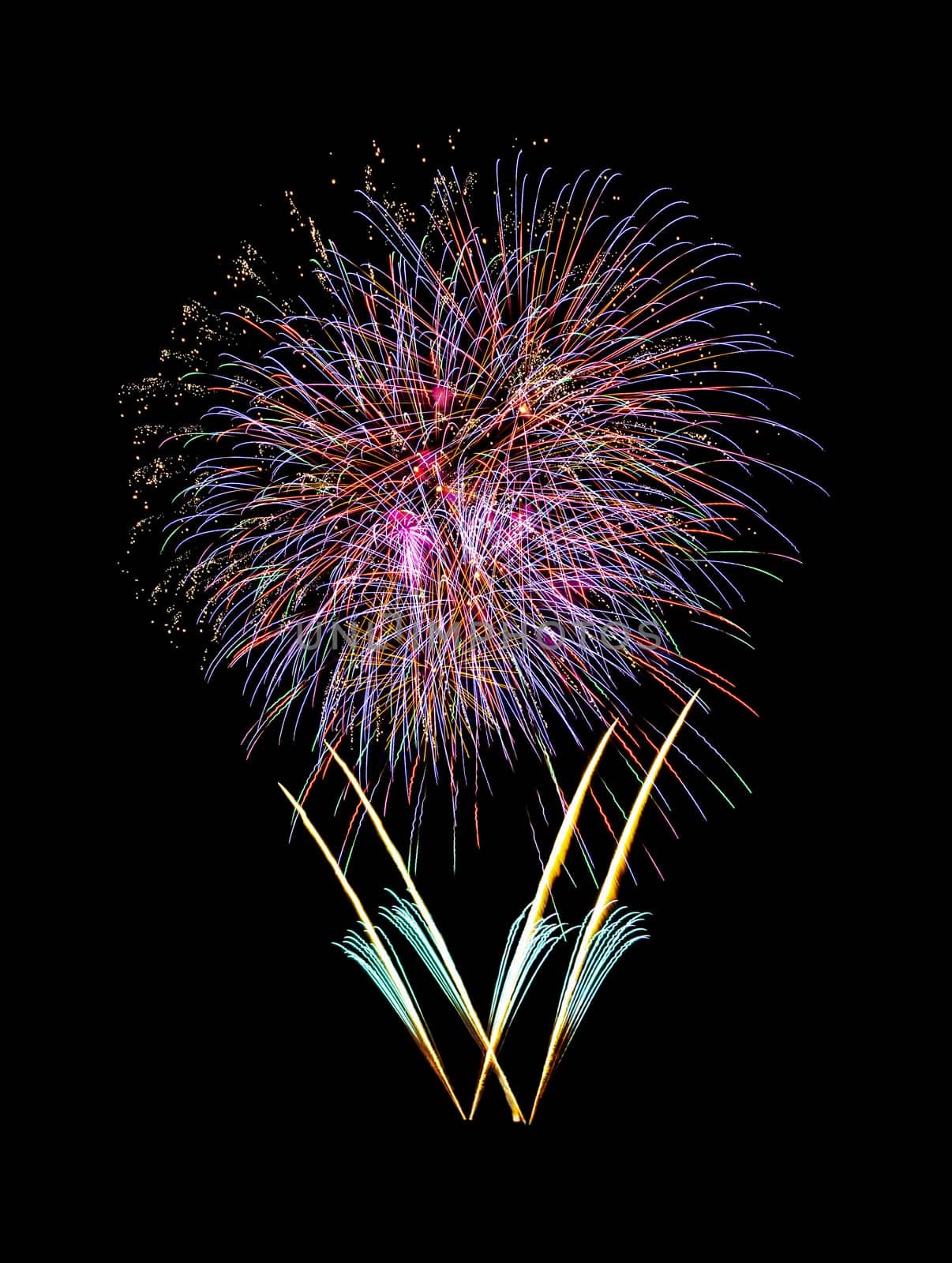 Beautiful colorful fireworks exploding in the night sky, isolated on black background. New year and anniversary concept.