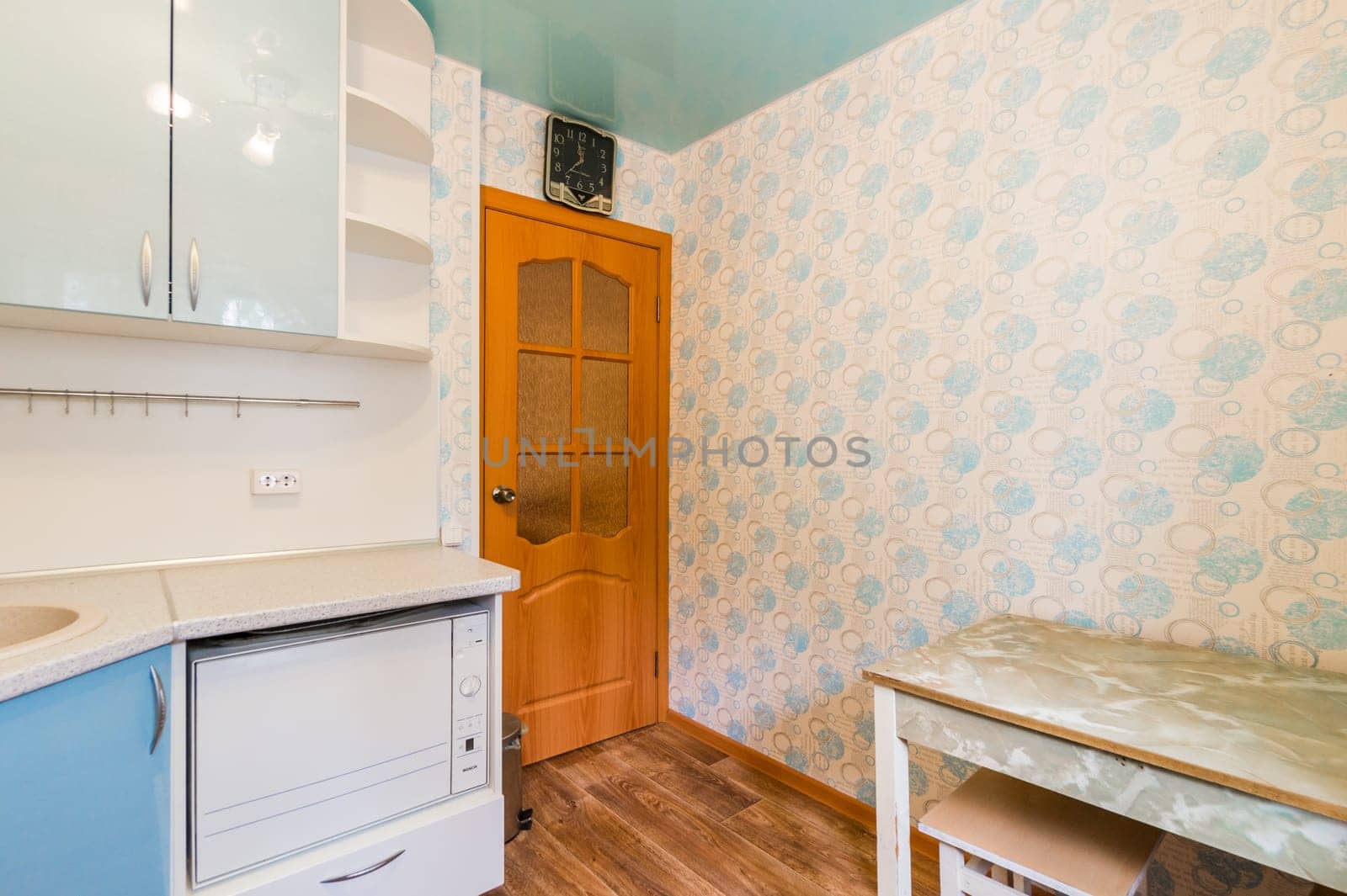 Russia, Moscow- July 16, 2019: interior room apartment. standard repair decoration in hostel. kitchen, dining area