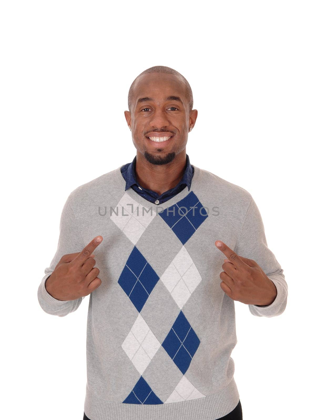 A handsome African American man standing in a sweater, smiling.and pointing with his fingers at himself, isolated for white background.