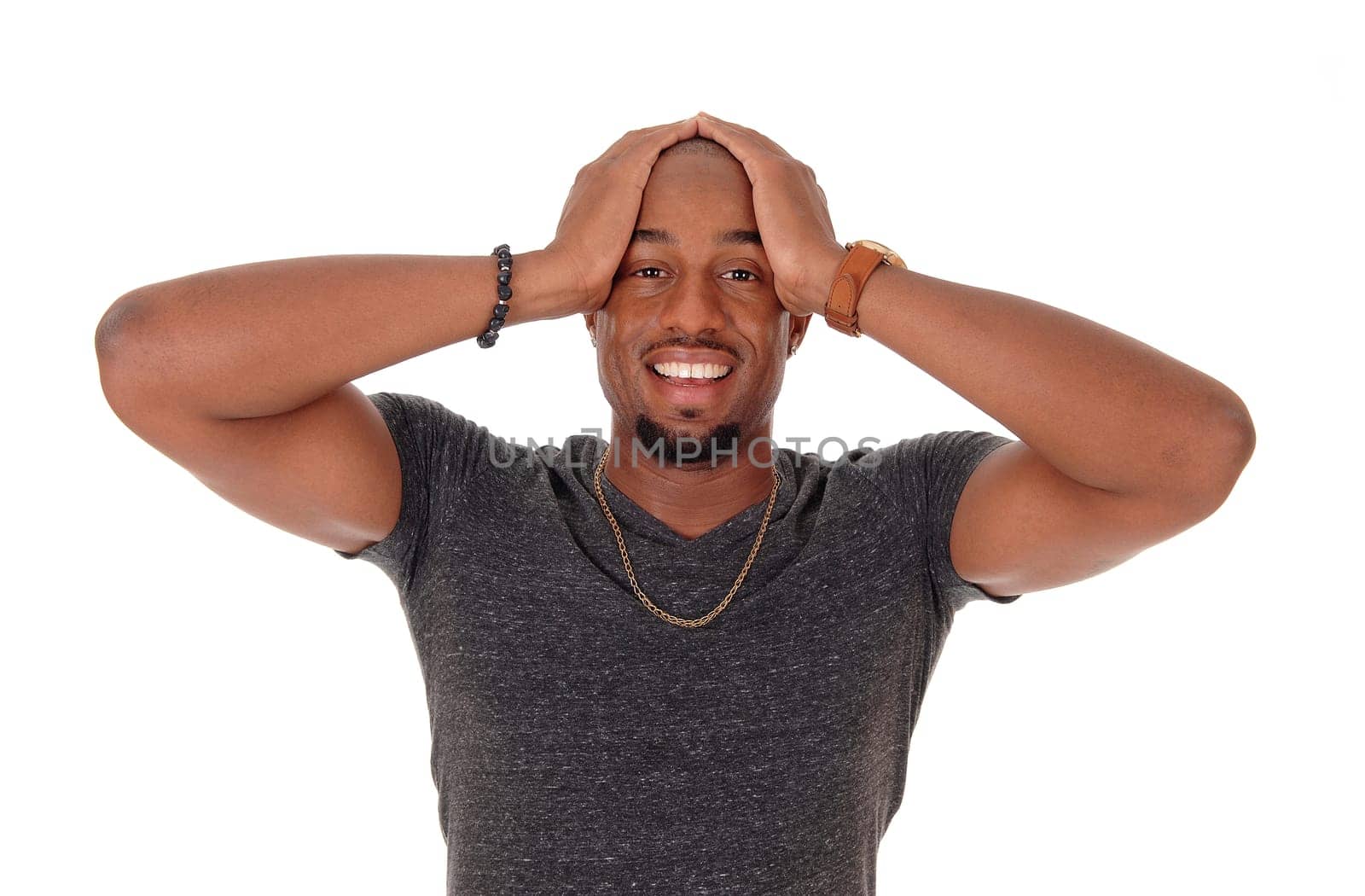 A young handsome African American man standing waist up in the.studio with one hand on head, thinking, isolated for white background.