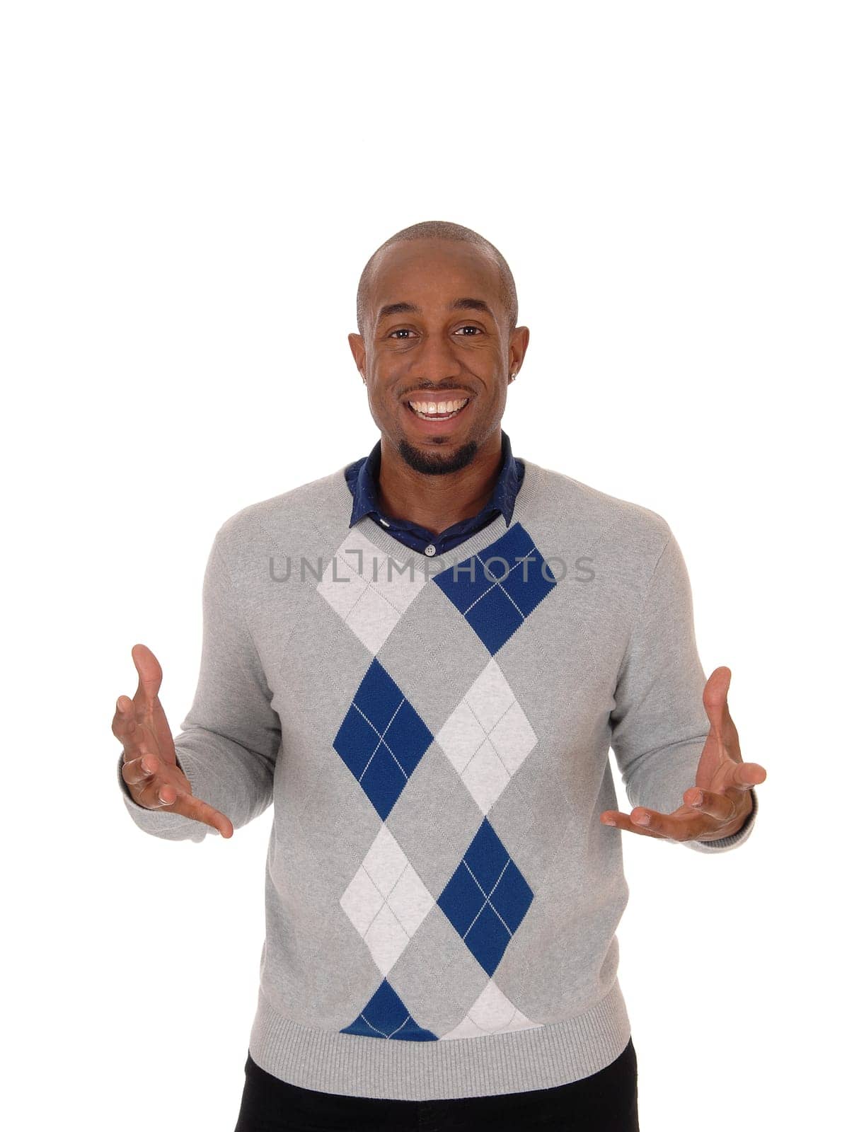 A smiling young African American man standing with his hands.open making an inviting pose, isolated for white background.
