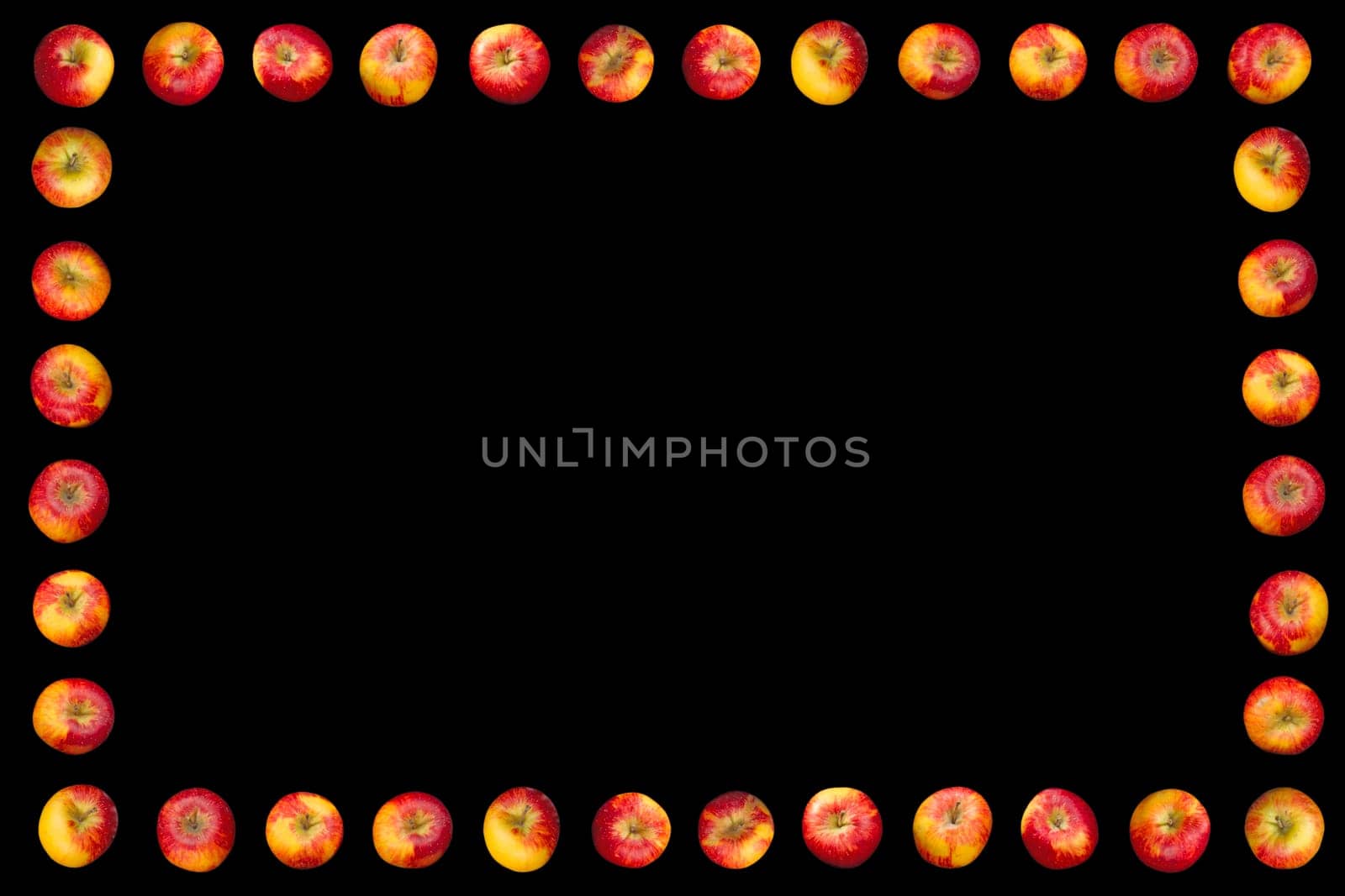Frame of apples isolated on a black background.