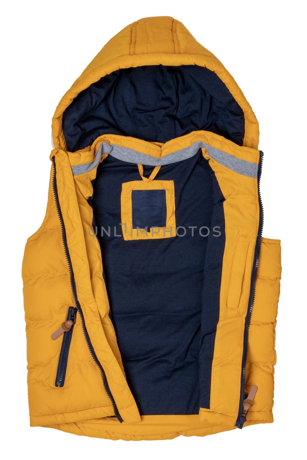 Vest isolated. Close-up of a stylish cozy warm yellow down vest with hood isolated on a white background. Childrens autum and winter clothes.