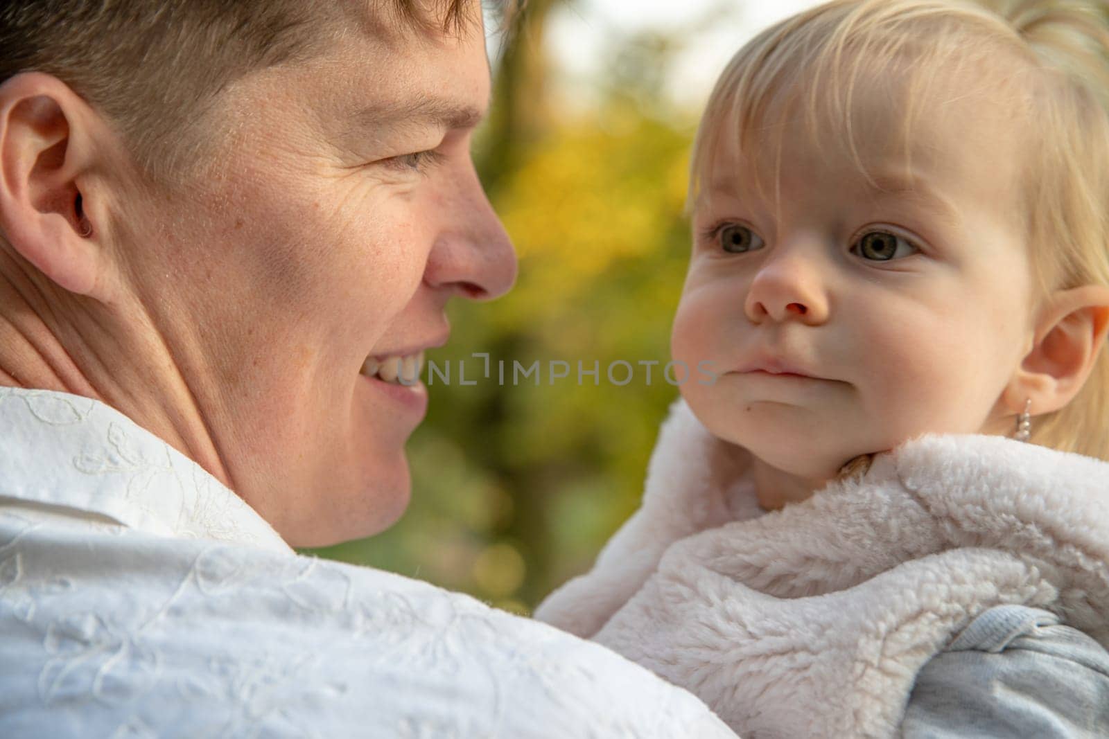 Dad and daughter enjoying autumn in a castle park at beautiful weather