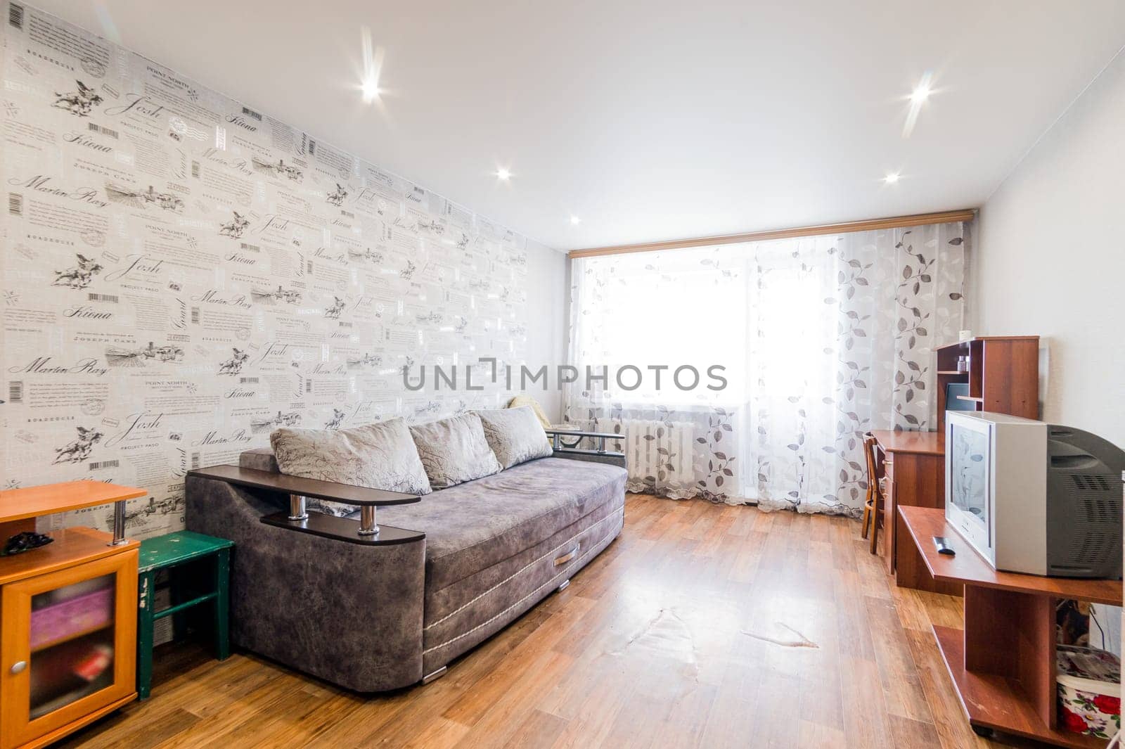 Russia, Moscow- July 23, 2019: interior room apartment. standard repair decoration in hostel. living room with sofa