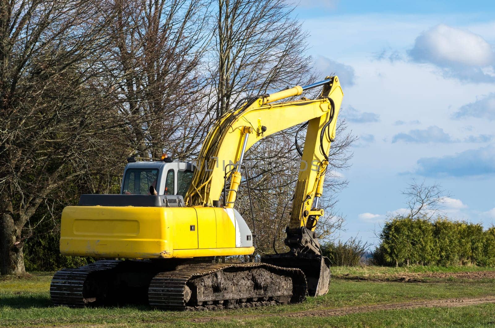 The old excavator stay in the field after works