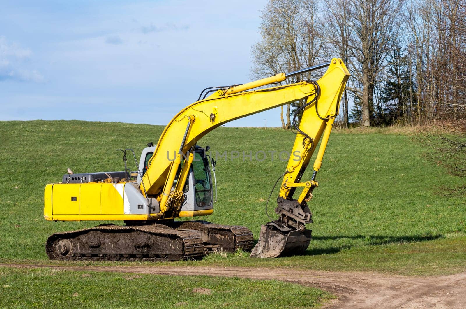 The old excavator stay in the field after works