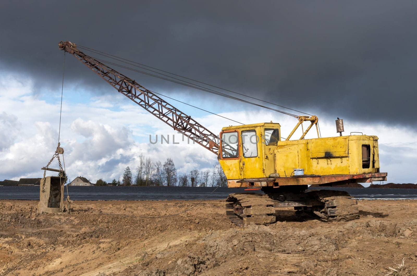 The old excavator stay in the field after works