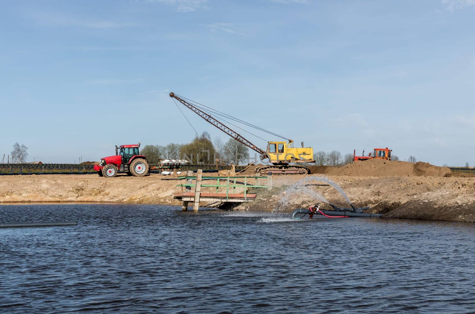 Tractor and excavator stay in the after hard work