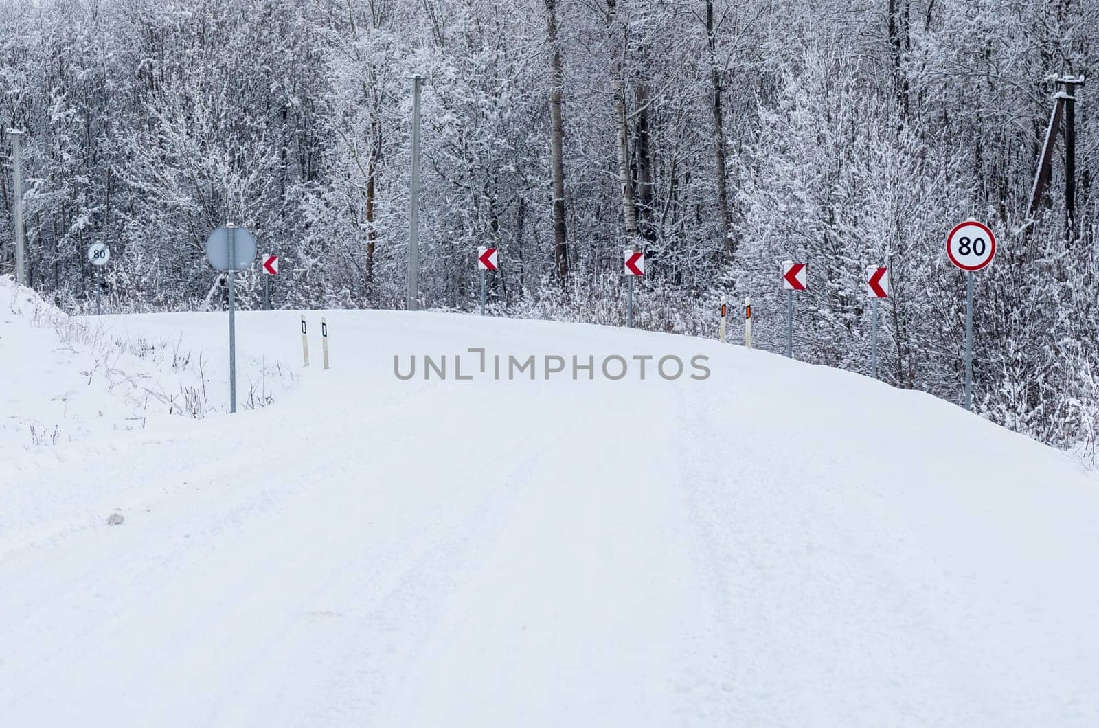 Road covered winter snow in the forest