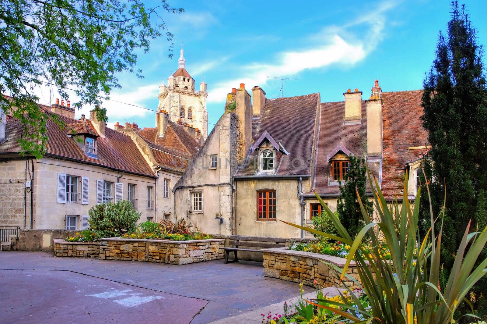 the town Dole, Place aux Fleurs and church in France