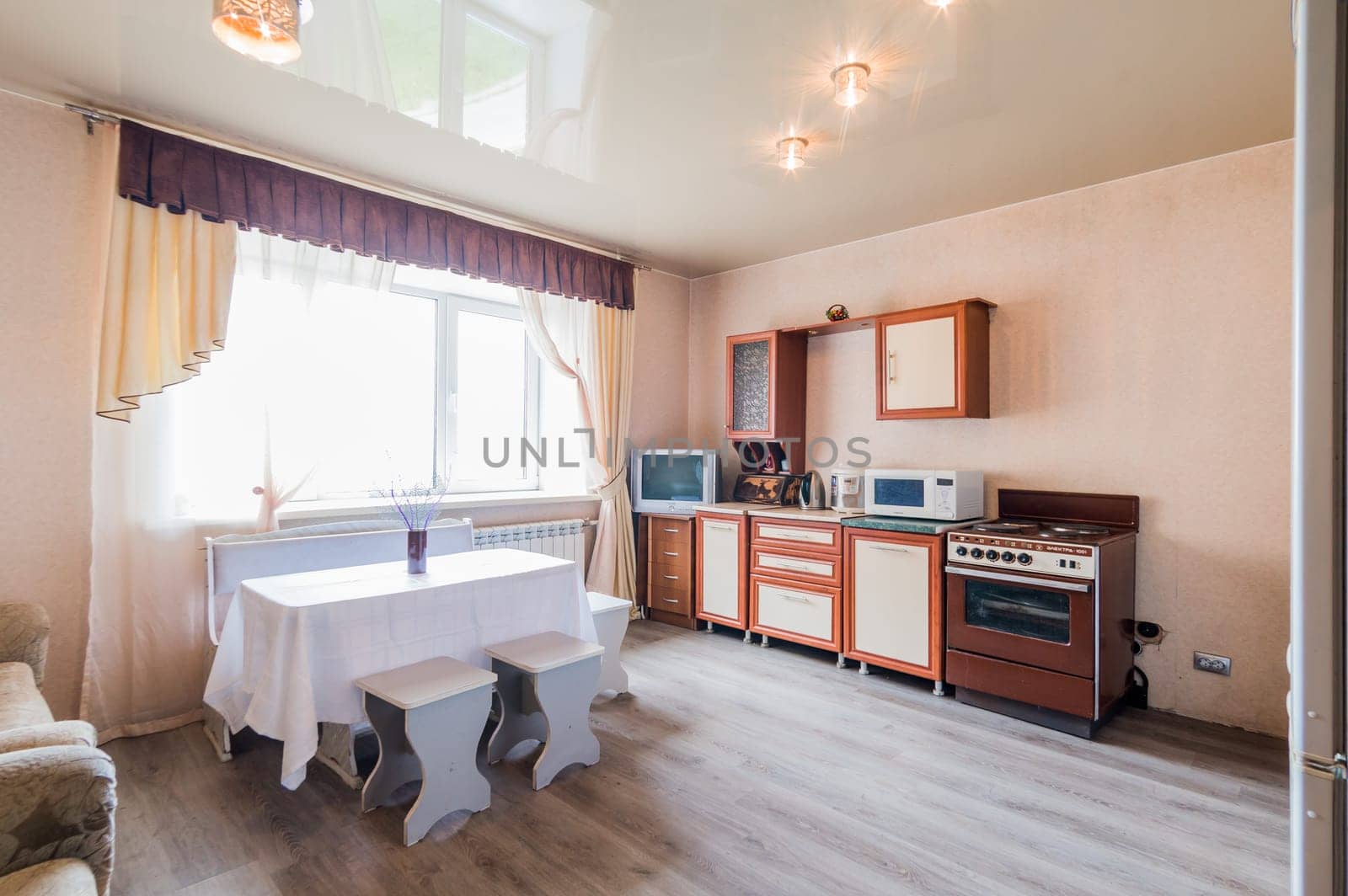 Russia, Moscow- July 23, 2019: interior room apartment. standard repair decoration in hostel. kitchen, dining area