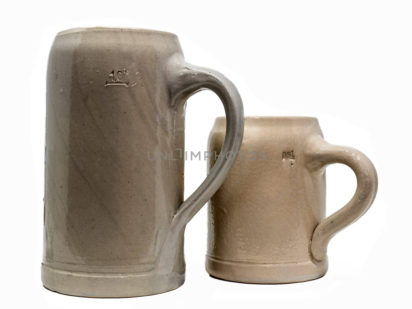 Two Bavarian Beer Mug made of stoneware with handle isolated on white