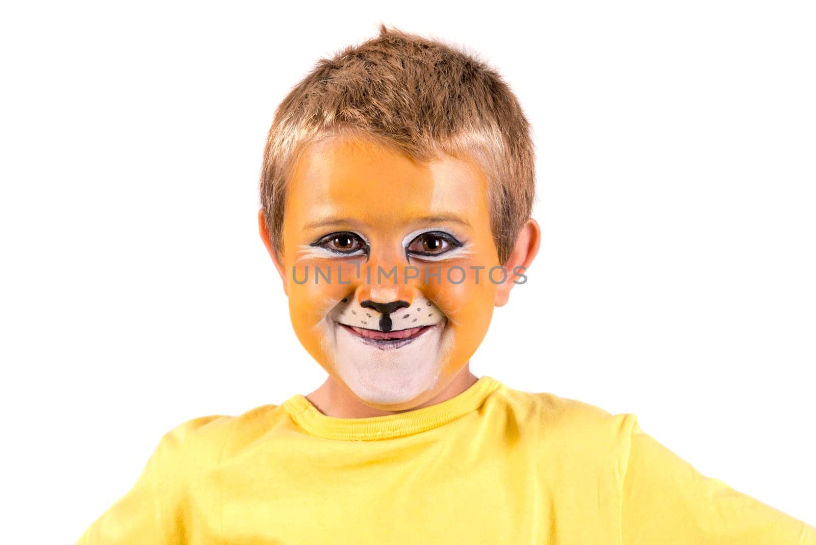 Boy with lion face-paint behind a white board