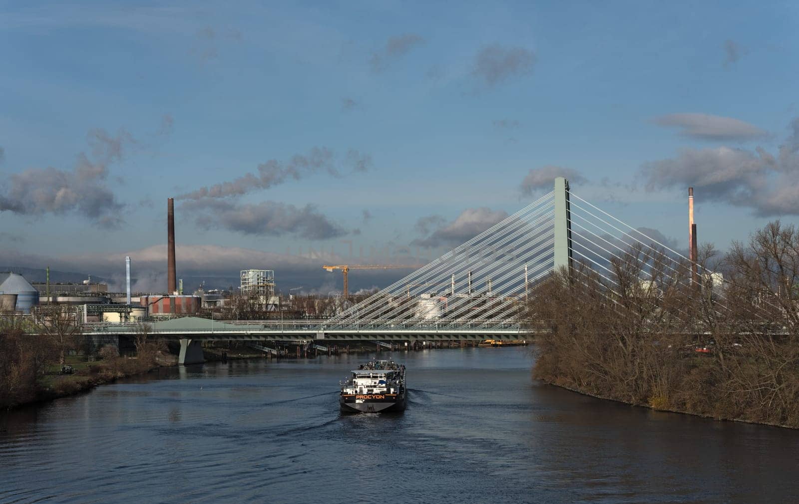 barge in front of industrial plants on the main river in frankfurt hoechst