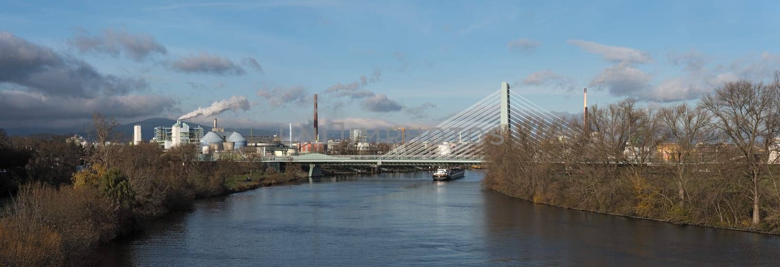 barge in front of industrial plants on the main river in frankfurt hoechst