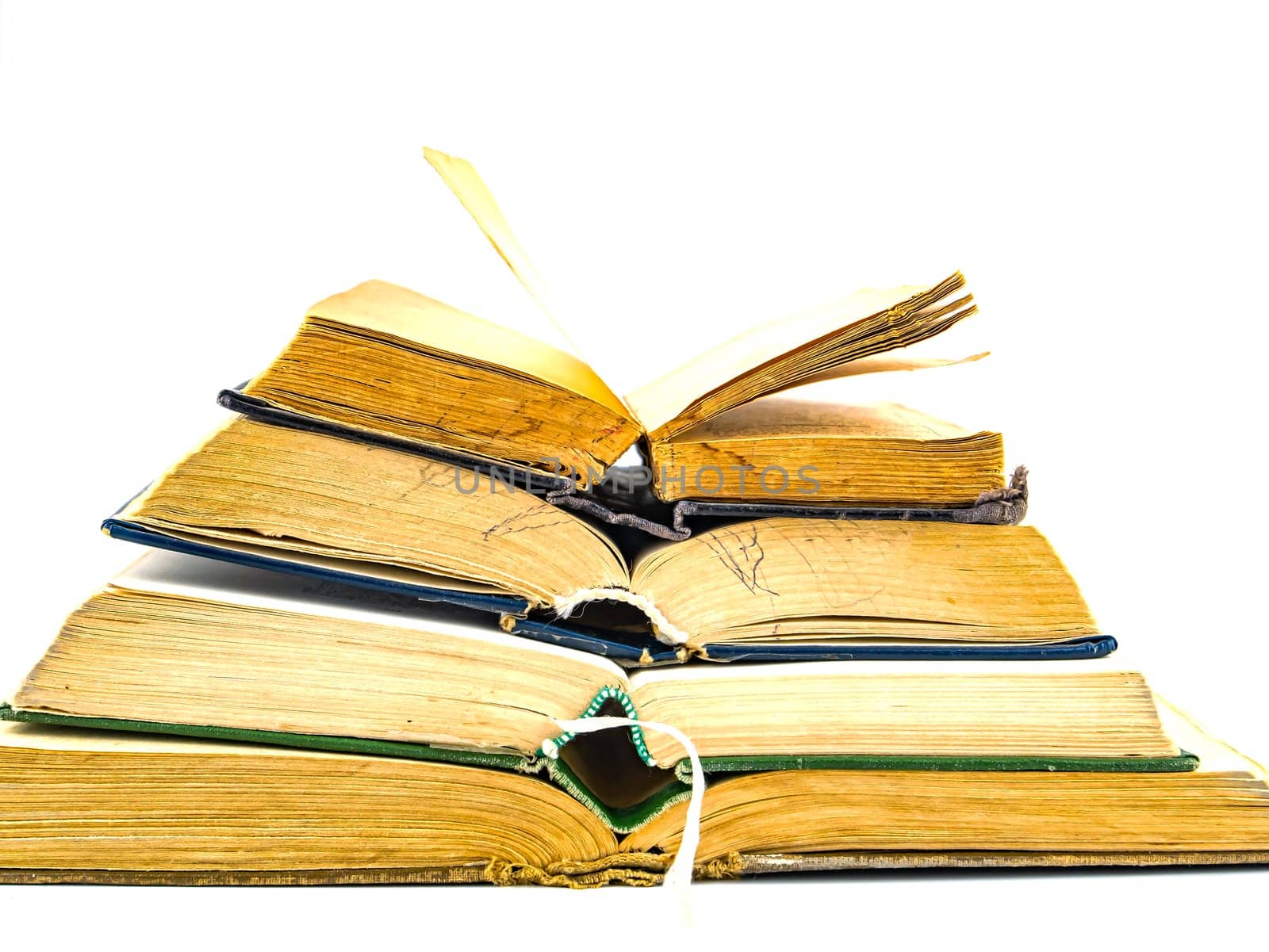 A stack of old books with place for text on a white background. Yellow Pages. Free place. Background image.