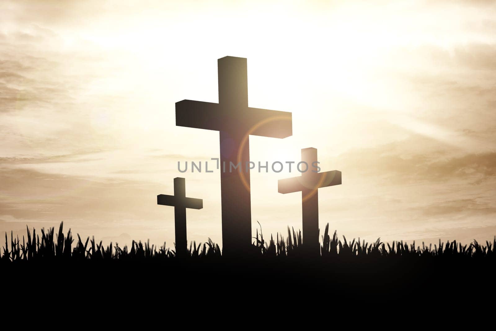 Christian cross on the grass with sunlight background