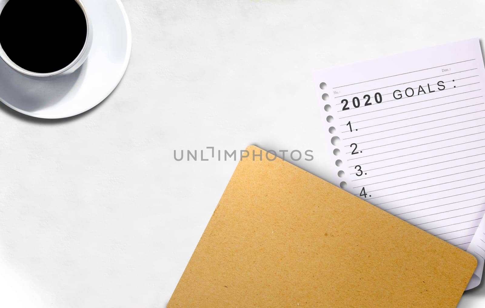 Empty list for 2020 goals in the paper on the desk. Goals of 2020. Happy New Year 2020