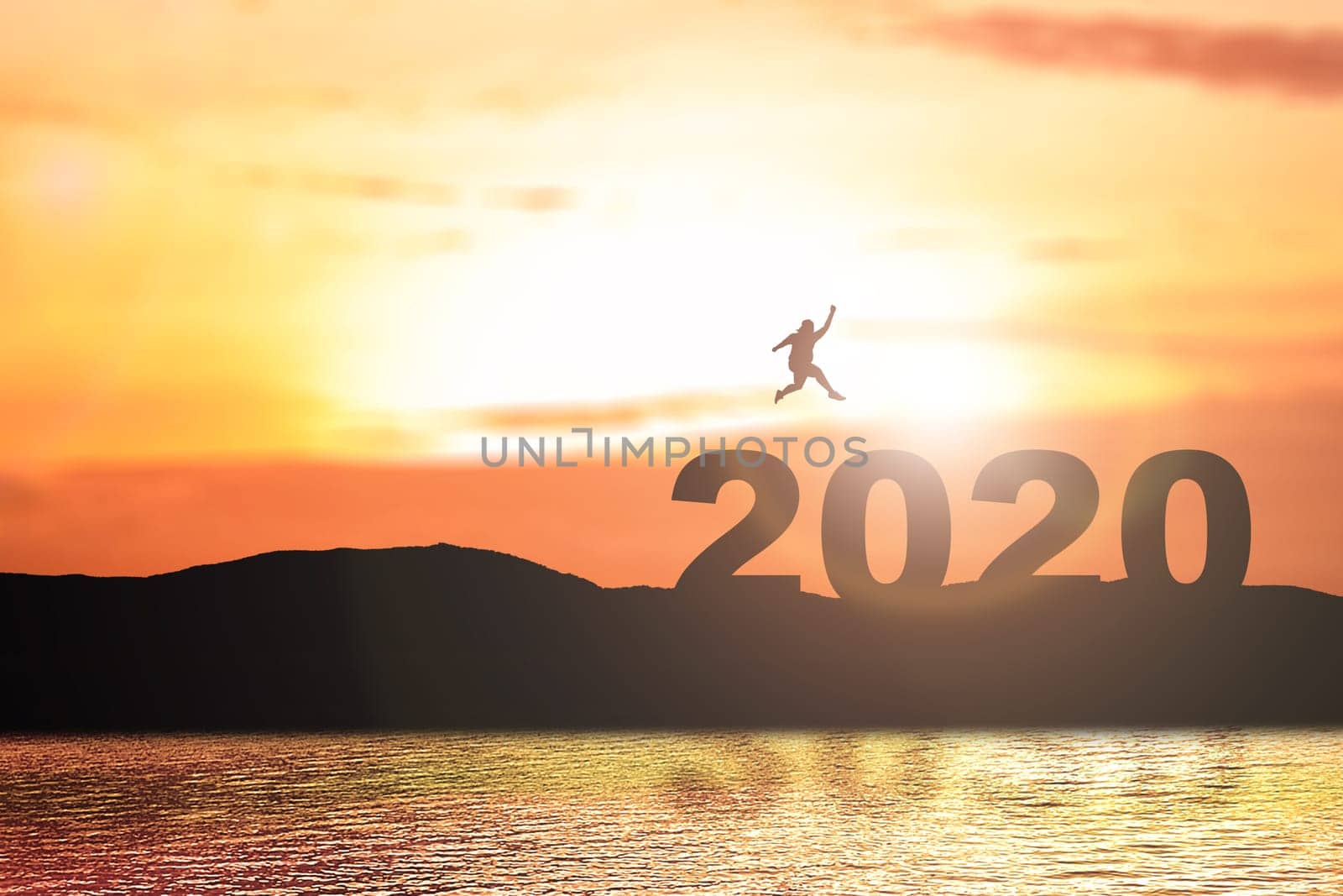 Silhouette of the fat man jumping above 2020 with a sunset sky background. Happy New Year 2020