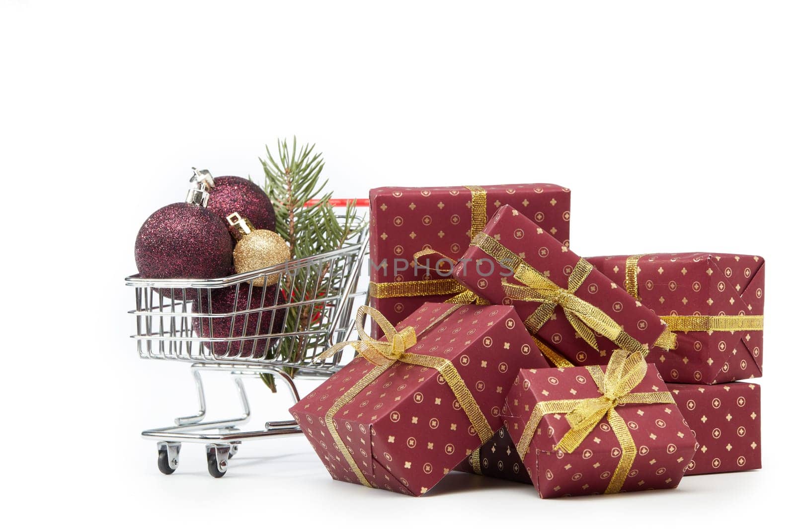 Shopping trolley, gift boxes and Christmas decoration isolated on white background, Christmas and New Year shopping. Winter sale.