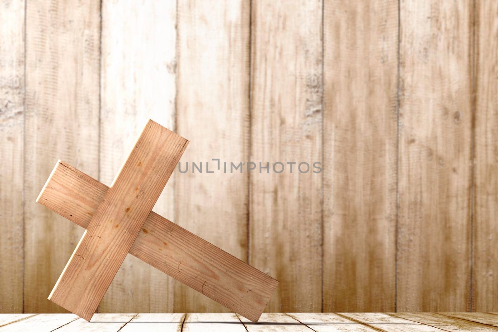 Christian Cross on the table with wooden wall background