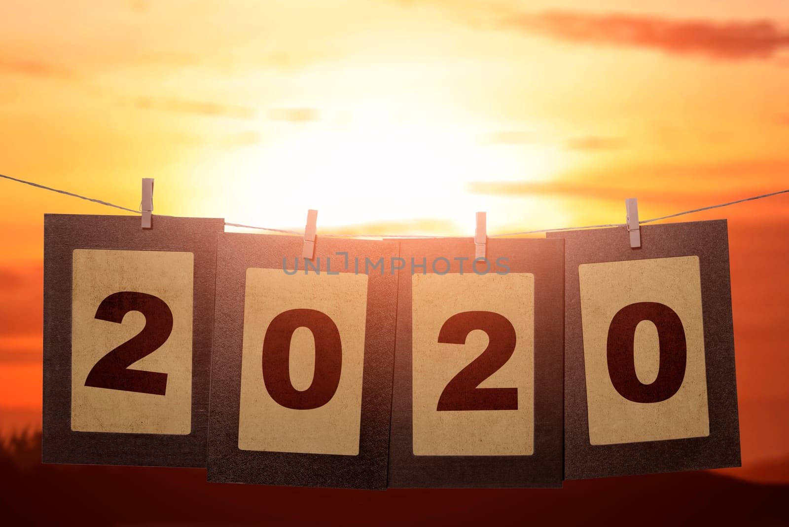 2020 on the cardboard hanging with rope. Happy New Year 2020