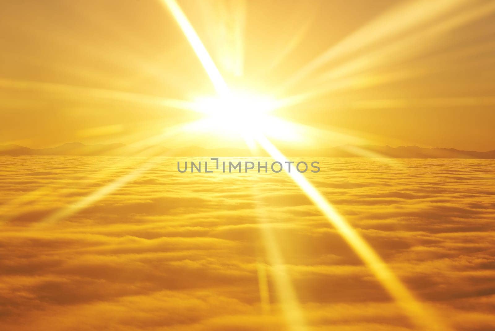 Amazing view from plane on the orange sky, sunset sun and clouds