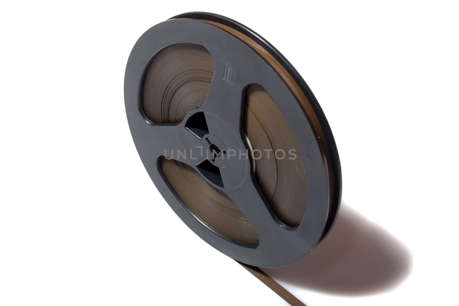 Vintage magnetic audio tape, reel to reel type on the white background
