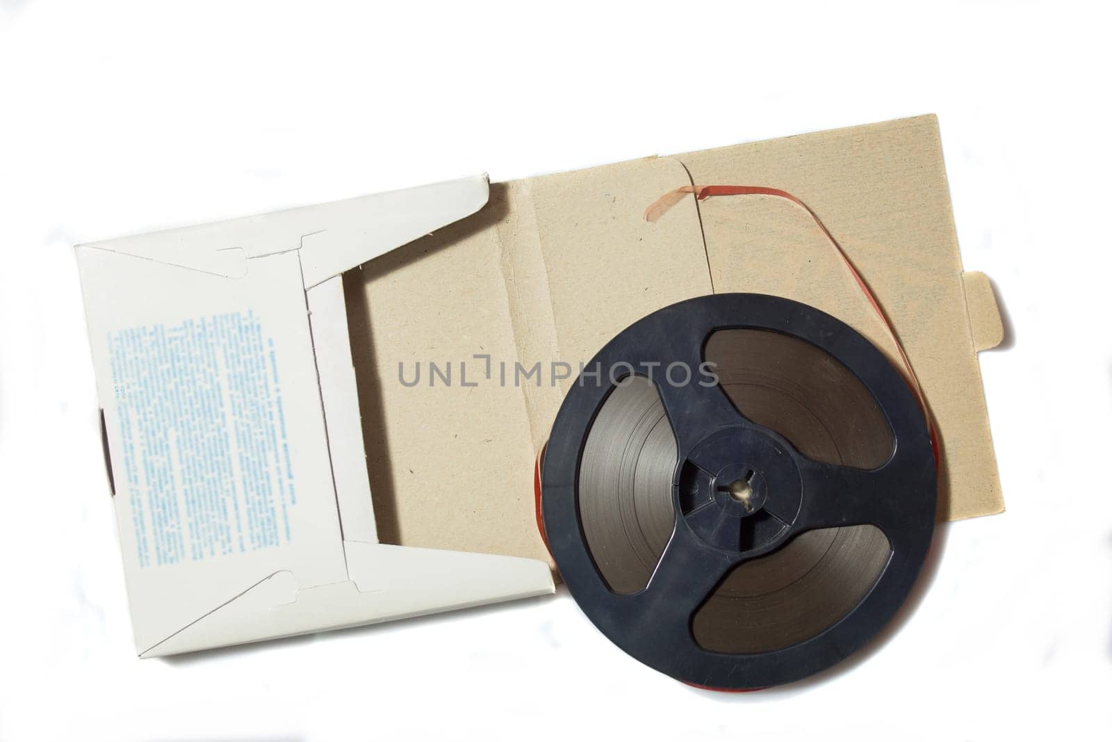 Vintage magnetic audio tape, reel to reel type, paper box on the white background