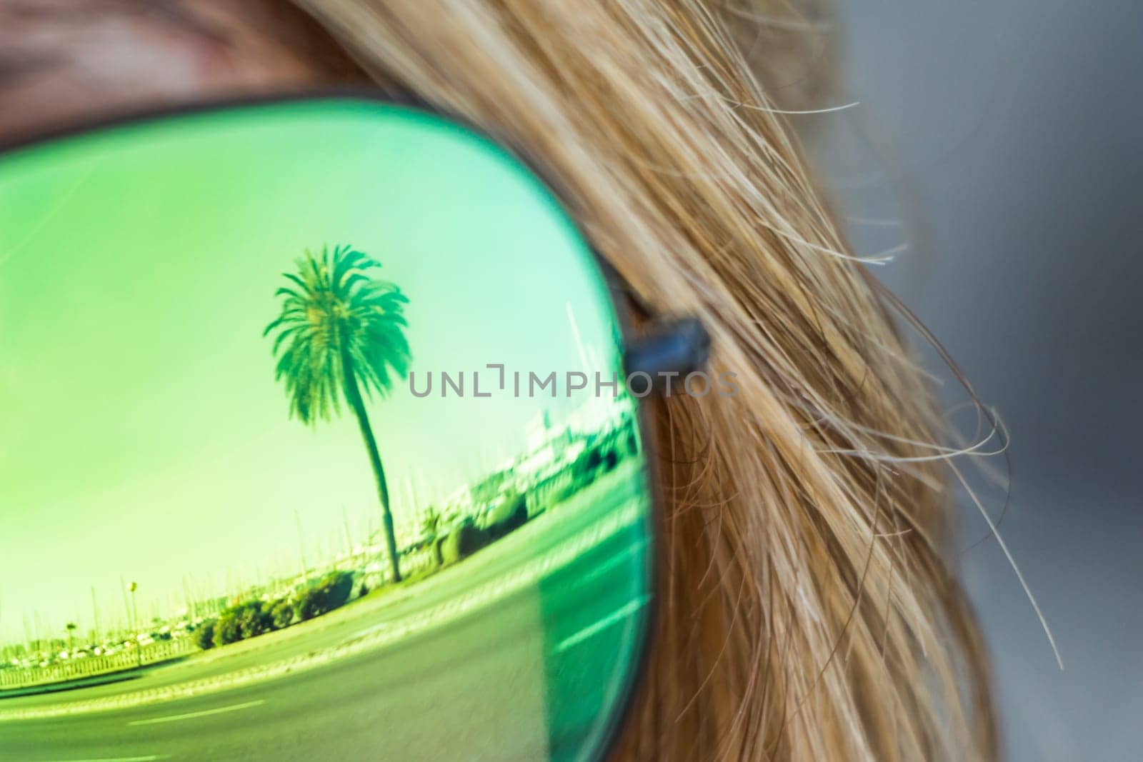 Exciting mirror imaging at sunglasses on head. Beautiful symbol of tourism vacation trip travelling to holiday dream island. Copypace.
