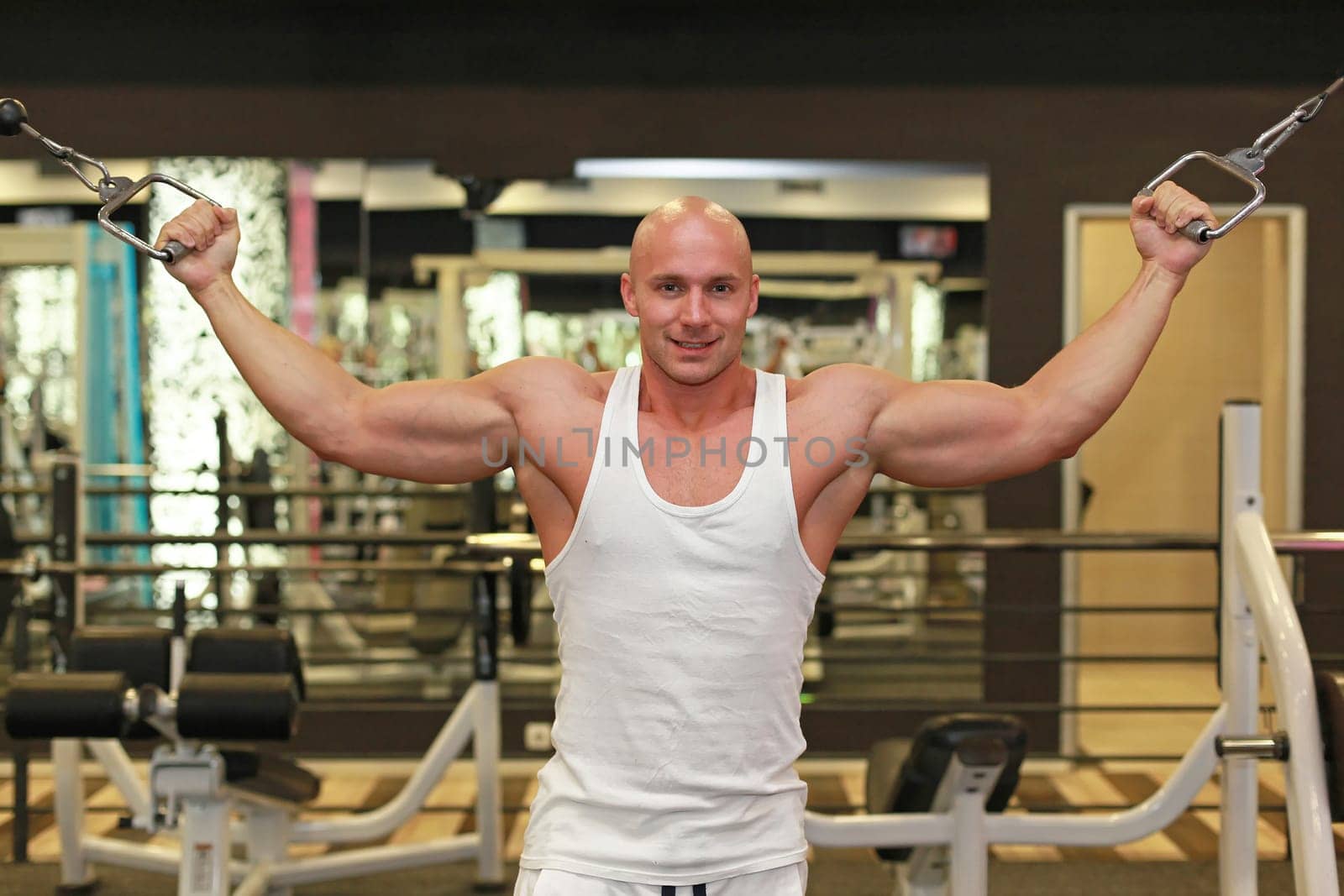 Young strong man workout exercise in gym