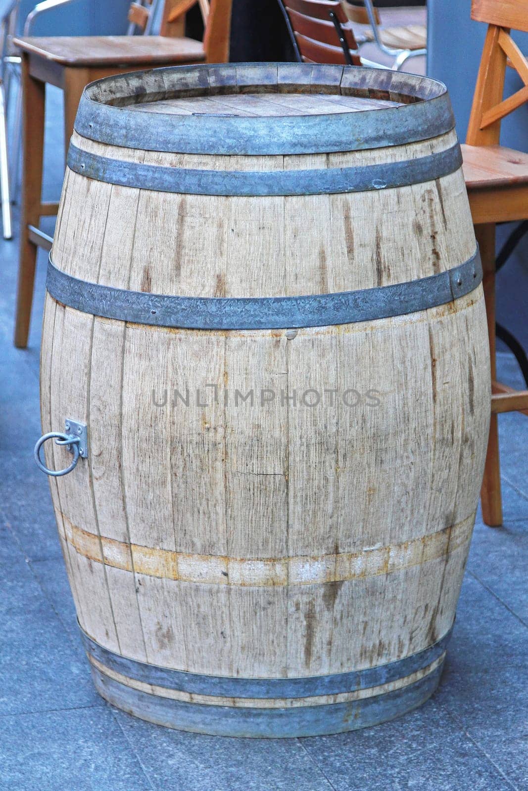 Old oak barrel in front of caffee