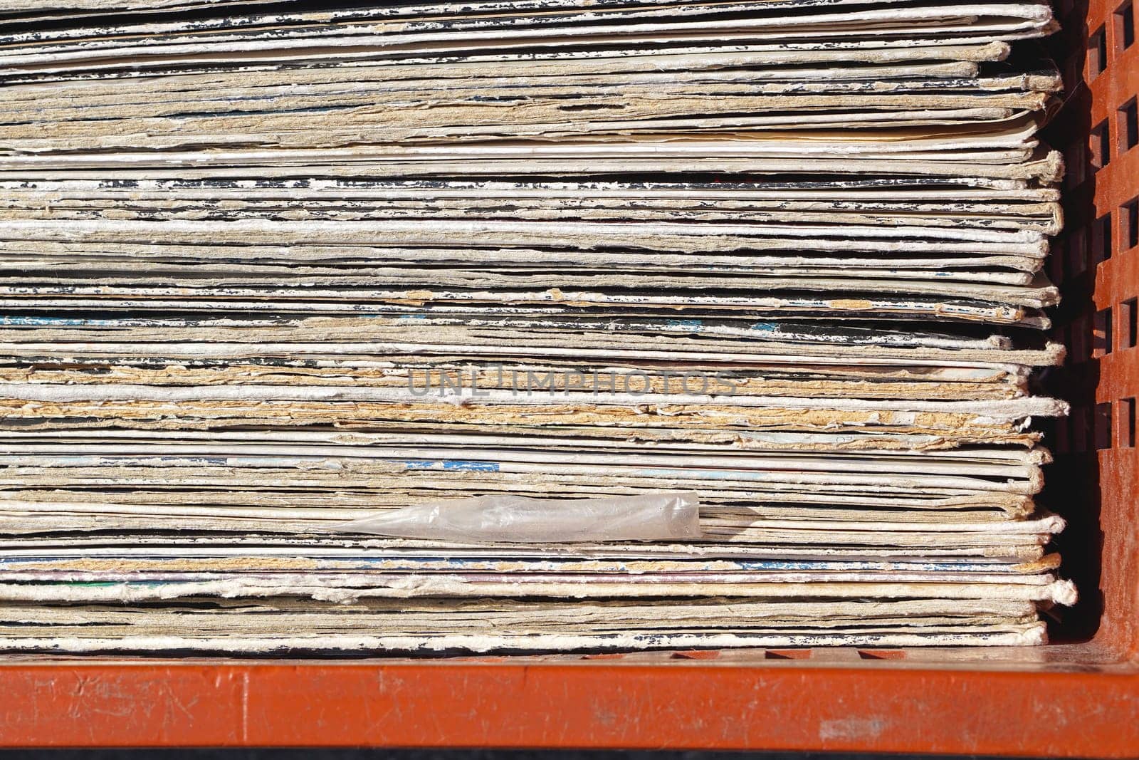 Stacked second hand vinyl records in crate