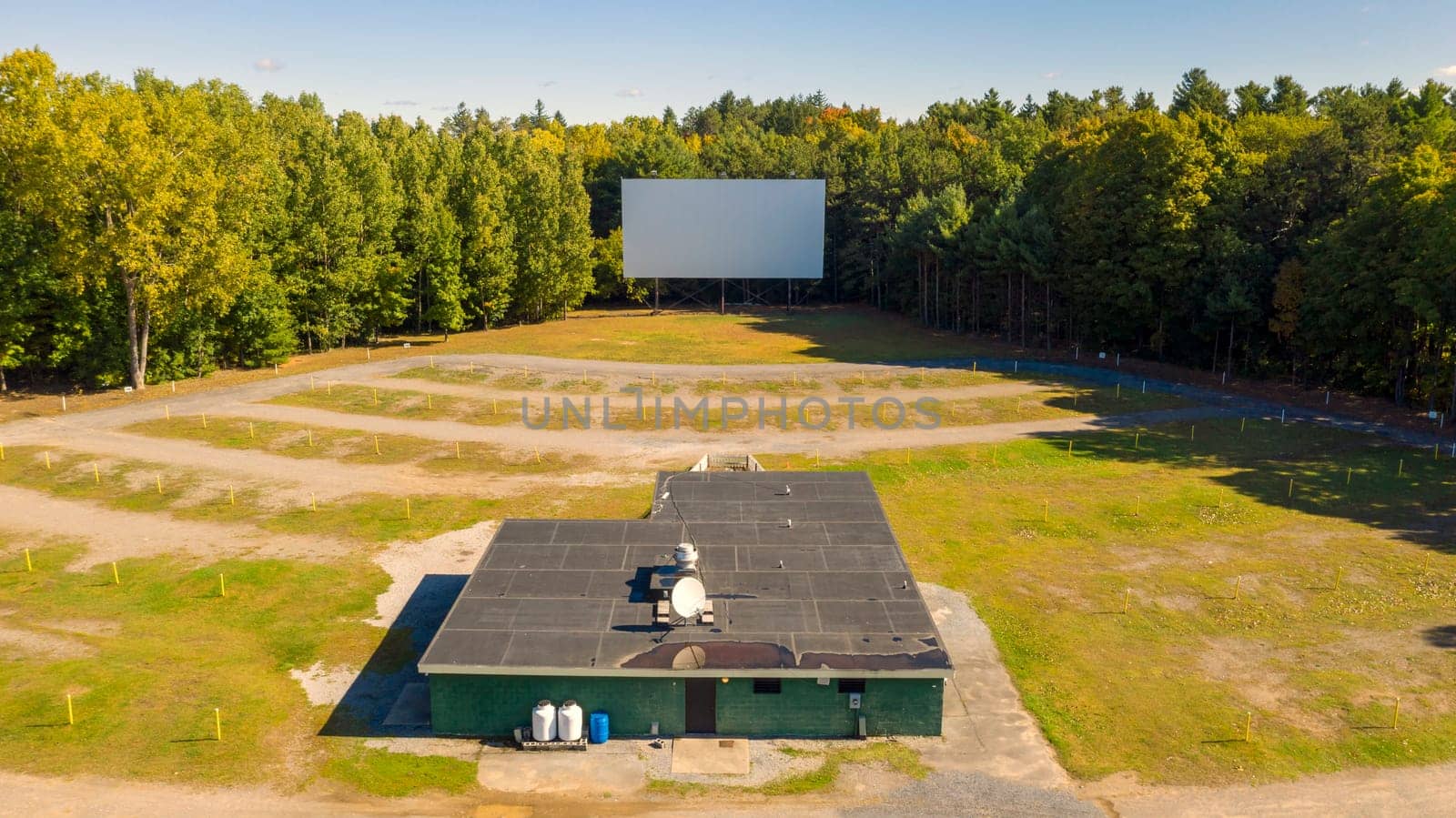The snack bar sound poles and projection screen still stand at this old Drive In