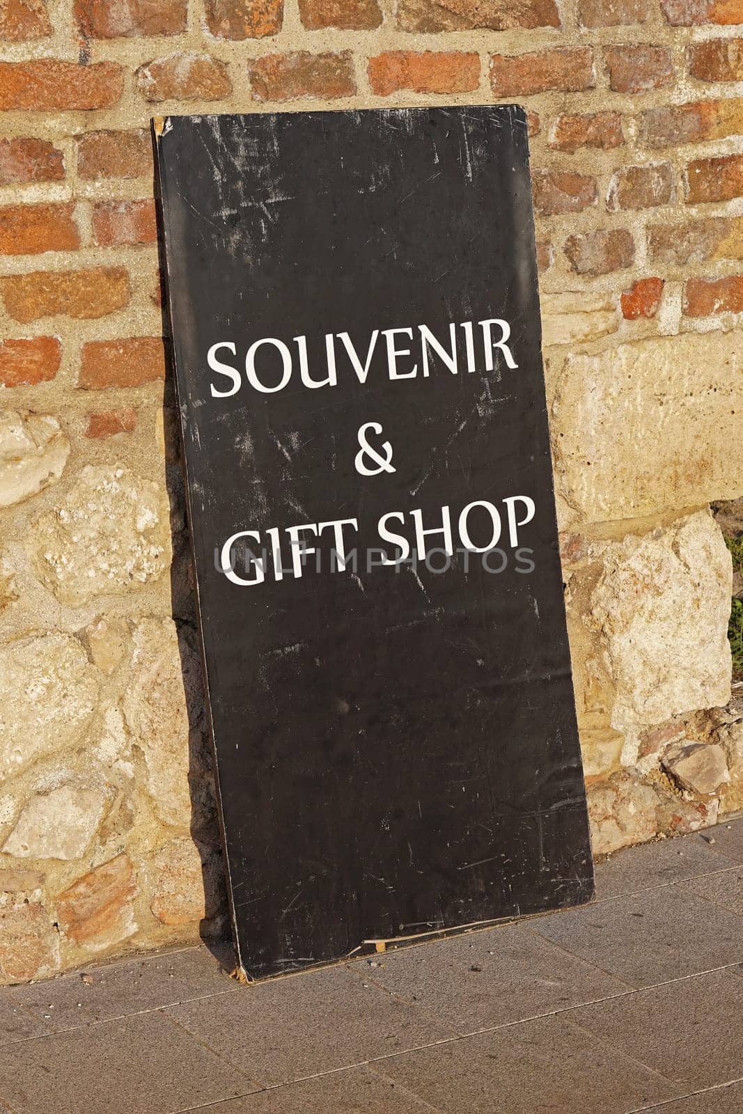 Souvenir and gift shop black board sign at wall