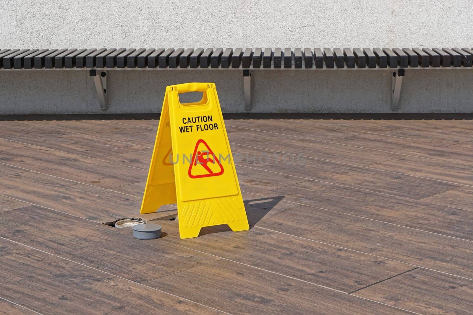 Caution wet floor sign at terrace patio