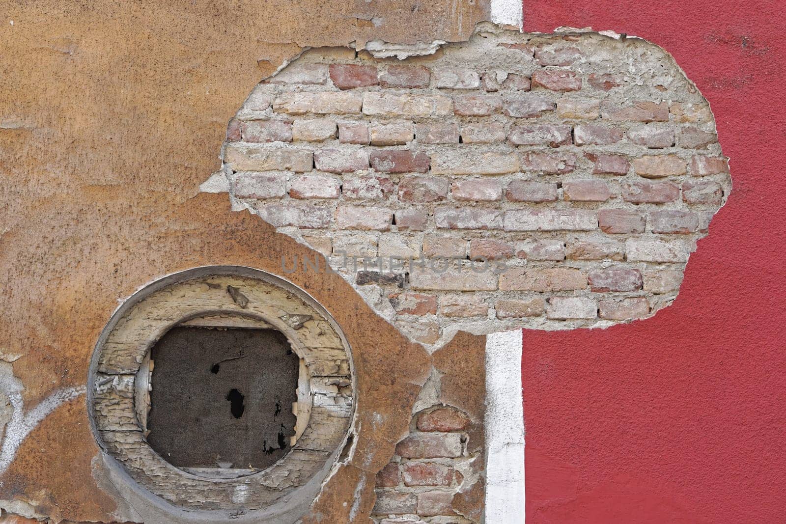 Damaged wall hole in facade old house