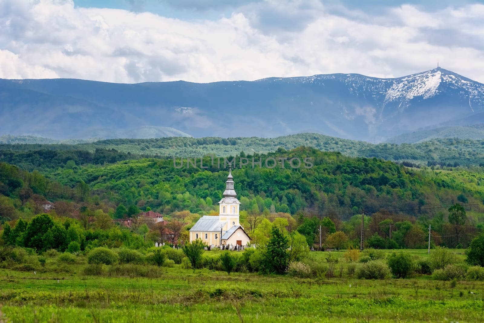 Church in front of Carpathian Mountains in Romania