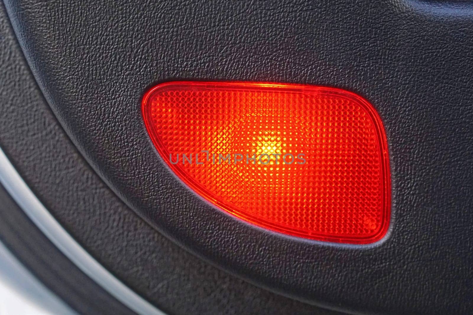 Red safety light at car door