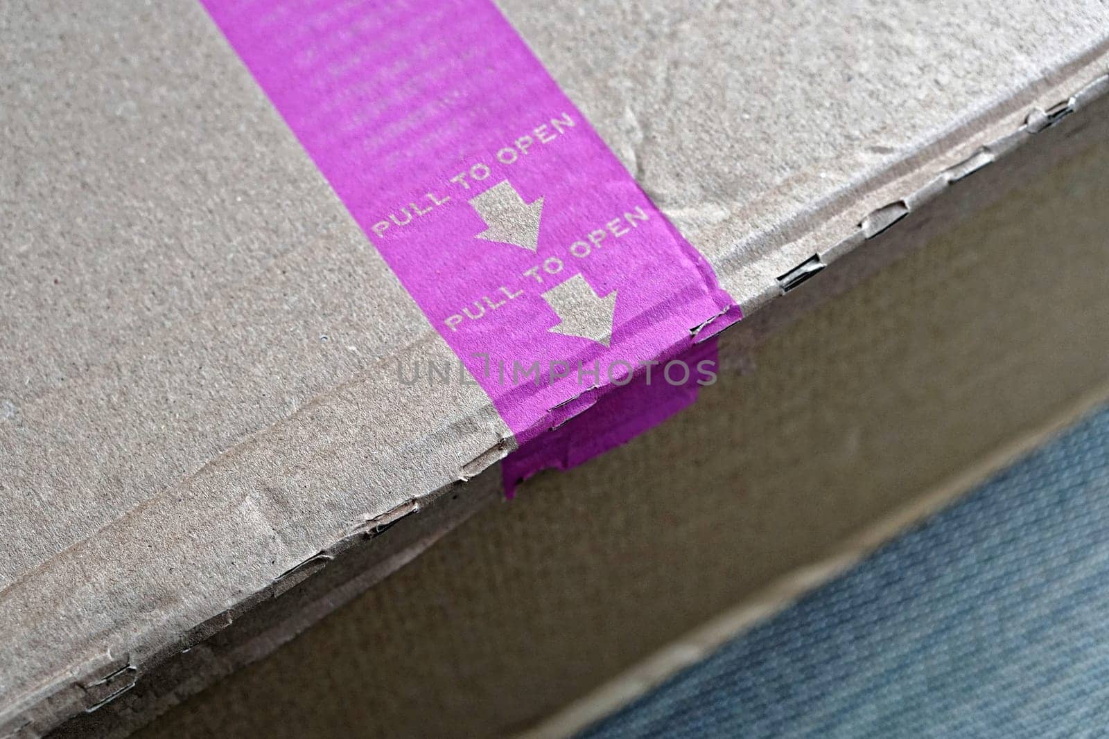 Pull to open easy strip at box