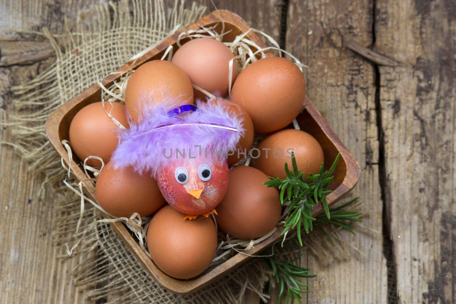eggs in a bowl on wooden background