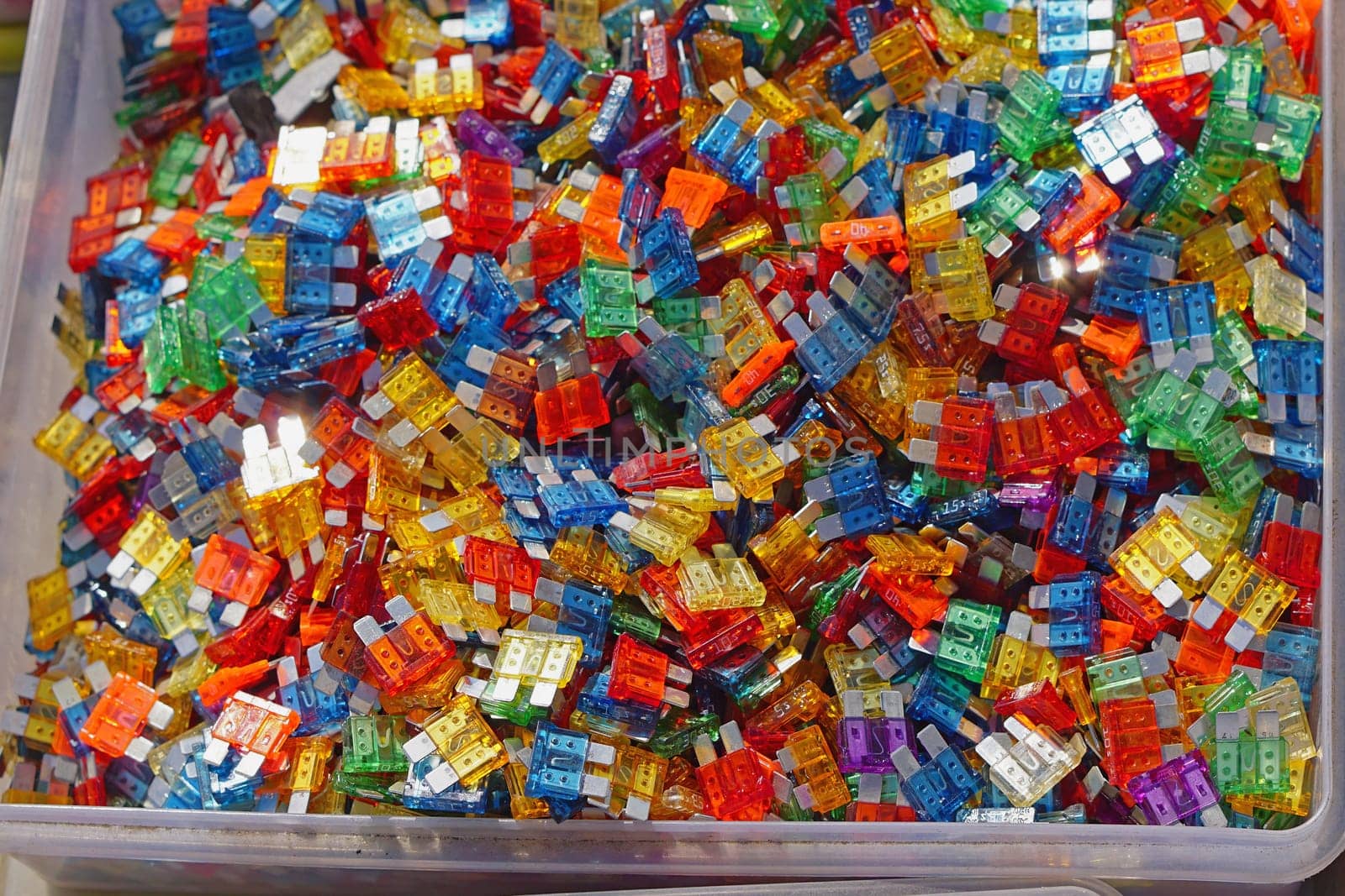 Many color coded fuses for cars in box